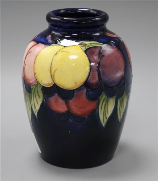 A Moorcroft vase wisteria and fruits Height 16cm